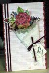 ribbons and doily to hold my flowers. I added a few dried and plastic flower fillers to made it 3-dimensional.